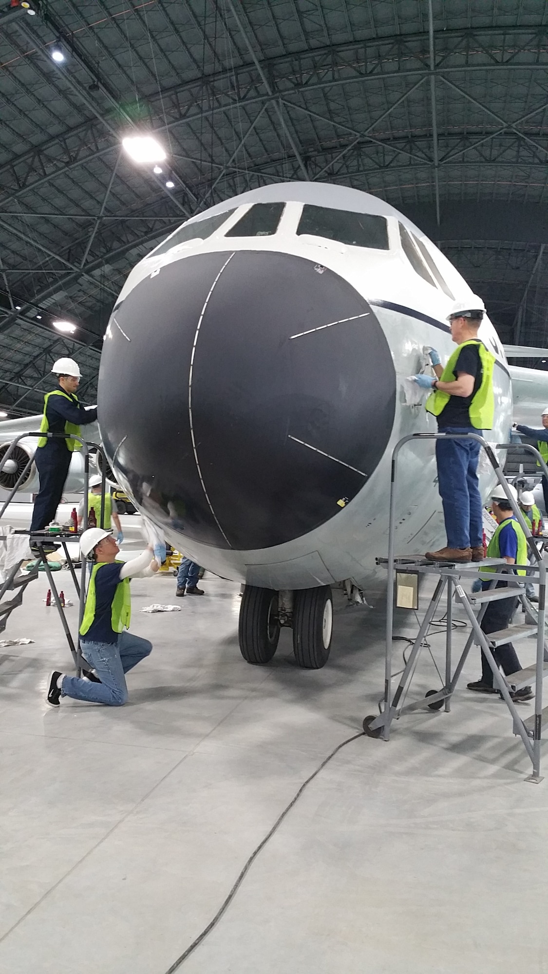 Volunteers cleaning and polishing the C-141 Starlifter "Hanoi Taxi" on January 28, 2016. The work is being done in preparation for the museum's new fourth building, which opens June 8th.