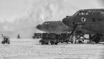 The 5th Civil Engineer Squadron removes snow from the flightline before a training sortie at Minot Air Force Base, N.D., Jan. 14, 2016. Bomber Airmen work around the clock in all weather conditions in order to provide B-52H Stratofortress firepower on demand. (U.S. Air Force photo/Airman 1st Class J.T. Armstrong)