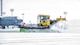 The 5th Civil Engineer Squadron removes snow from the flightline before a training sortie at Minot Air Force Base, N.D., Jan. 14, 2016. Bomber Airmen work around the clock in all weather conditions in order to provide B-52H Stratofortress firepower on demand. (U.S. Air Force photo/Airman 1st Class J.T. Armstrong)