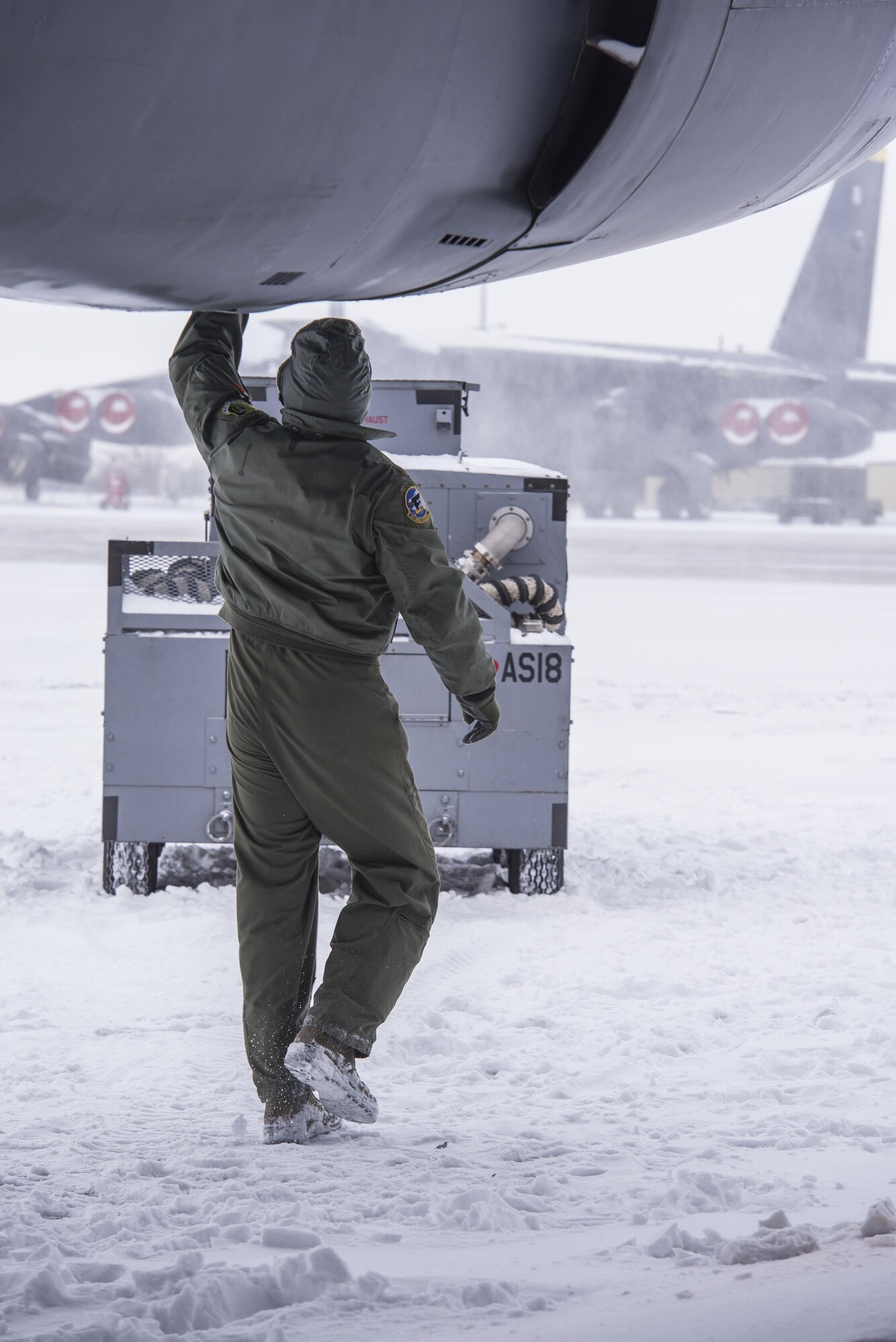 Maj. Luke Dellenbach, 69th Bomb Squadron assistant director of operations, goes through pre-flight checks on a B-52H Stratofortress before a training sortie at Minot Air Force Base, N.D., Jan. 14, 2016. Bomber Airmen work around the clock in all weather conditions in order to provide B-52H Stratofortress firepower on demand. (U.S. Air Force photo/Airman 1st Class J.T. Armstrong)