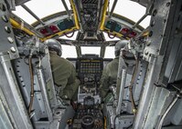 Pilots from the 69th Bomb Squadron go through a pre-flight checklist inside the cockpit of a B-52H Stratofortress before a training sortie at Minot Air Force Base, N.D., Jan. 14, 2016. Bomber Airmen work around the clock in all weather conditions in order to provide B-52H Stratofortress firepower on demand. (U.S. Air Force photo/Airman 1st Class J.T. Armstrong)