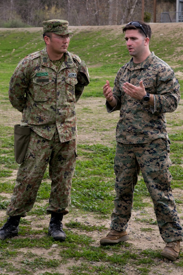 U.S. Marine Sgt. Robert Murphy, Pre-Scout Sniper Instructor, gives feedback to Japan Ground Self-Defense Force (JGSDF) soldiers after practicing the bounding drills at the unknown distance live-fire event during Exercise Iron Fist 2016 aboard Marine Corps Base Camp Pendleton, Calif., Jan. 27. Exercise Iron Fist is an annual, bilateral training exercise between the U.S. Marine Corps and the JGSDF designed to improve their planning, communicating, and conducting of combined amphibious operations. (U.S. Marine Corps photo by Lance Cpl. Brandon Maldonado/ Released)