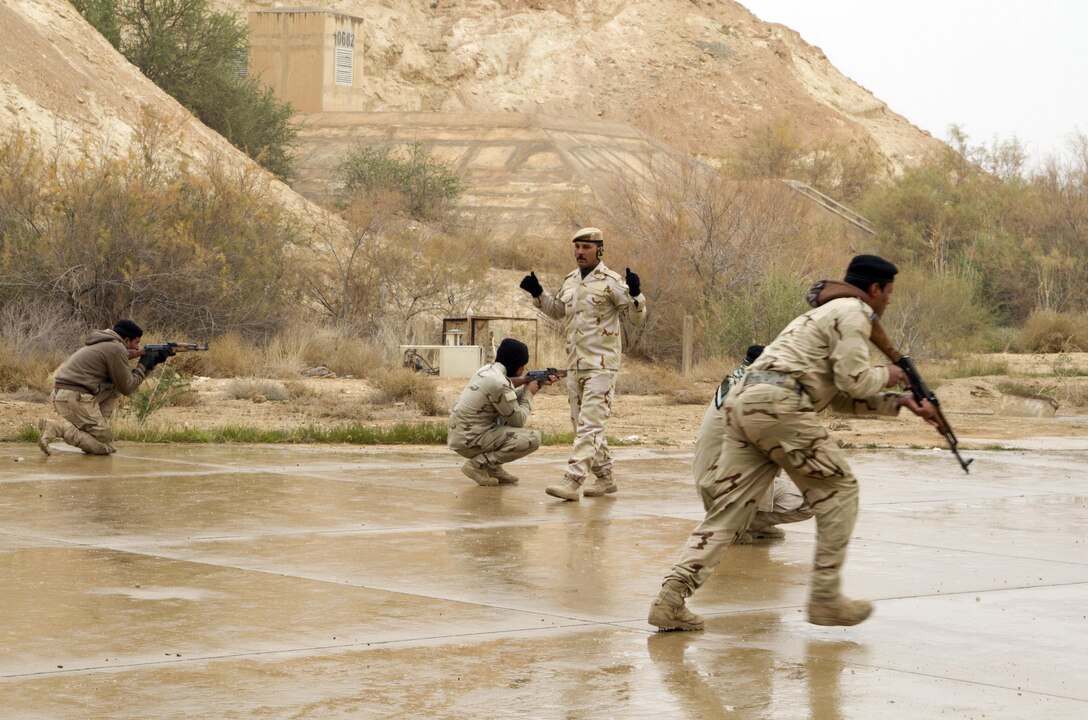 An Iraqi army noncommissioned officer directs Iraqi soldiers during squad movement training at Al Asad Air Base, Iraq, Jan. 15, 2015. Several Iraqi army battalions were training throughout Iraq with the assistance and support of coalition forces. U.S. Army photo by Sgt. William White
