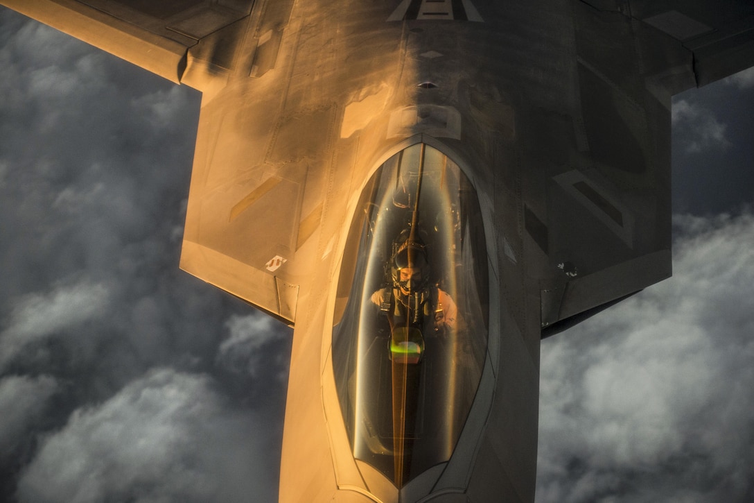 An Air Force F-22 Raptor flies over the Arabian Sea to support Operation Inherent Resolve, Jan. 27, 2016. Air Force photo by Staff Sgt. Corey Hook