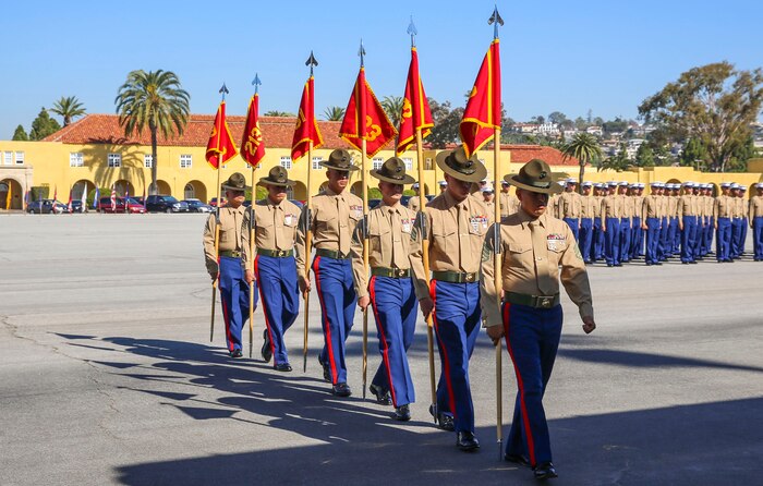 Drill instructors from Fox Company, 2nd Recruit Training Battalion, march in formation after receiving the guidons from the company honormen during the graduation ceremony at Marine Corps Recruit Depot San Diego, Jan. 29. Graduation takes place at the completion of a 13-week transformation including training in drill, marksmanship, basic combat skills and Marine Corps customs and traditions. Annually, more than 17,000 males recruited from the Western Recruiting Region are trained at MCRD San Diego.