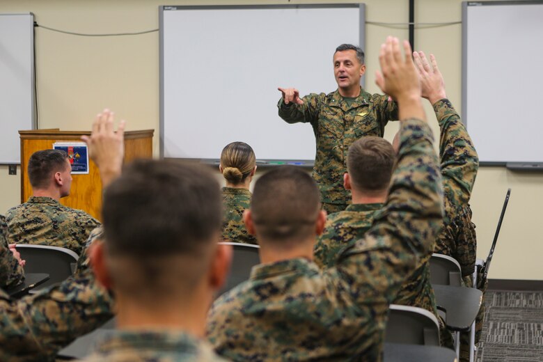 Maj. Gen. Michael Rocco, commanding general of 3rd Marine Aircraft Wing, talks to Marines with Marine Aircraft Group (MAG) 39 Corporals Course 341-16 aboard Marine Corps Base Camp Pendleton, Calif., Jan. 14. Eighty-one Marines graduated the three-week long training course, Jan. 27. (U.S. Marine Corps photo by Lance Cpl. Harley Robinson/Released)