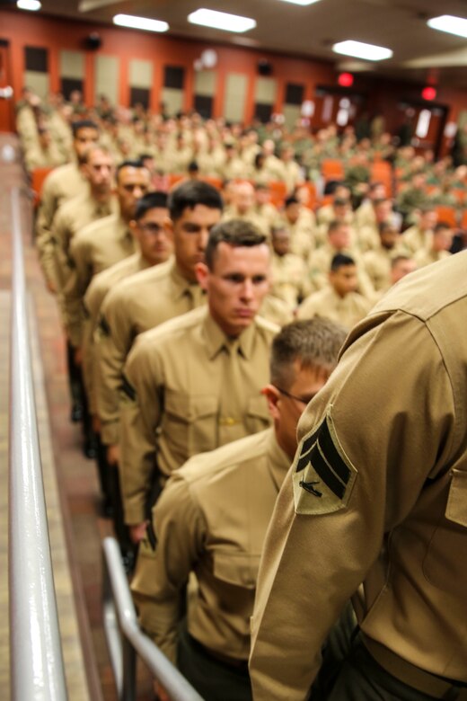 Marines with Marine Aircraft Group 39 (MAG) Corporals Course 341-16 stand in line to receive their certificate during their graduation aboard Marine Corps Base Camp Pendleton, Calif., Jan. 27. Eighty-one Marines graduated the three-week long training course required for corporals to earn the next rank. (U.S. Marine Corps photo by Cpl. Alissa Schuning/Released)