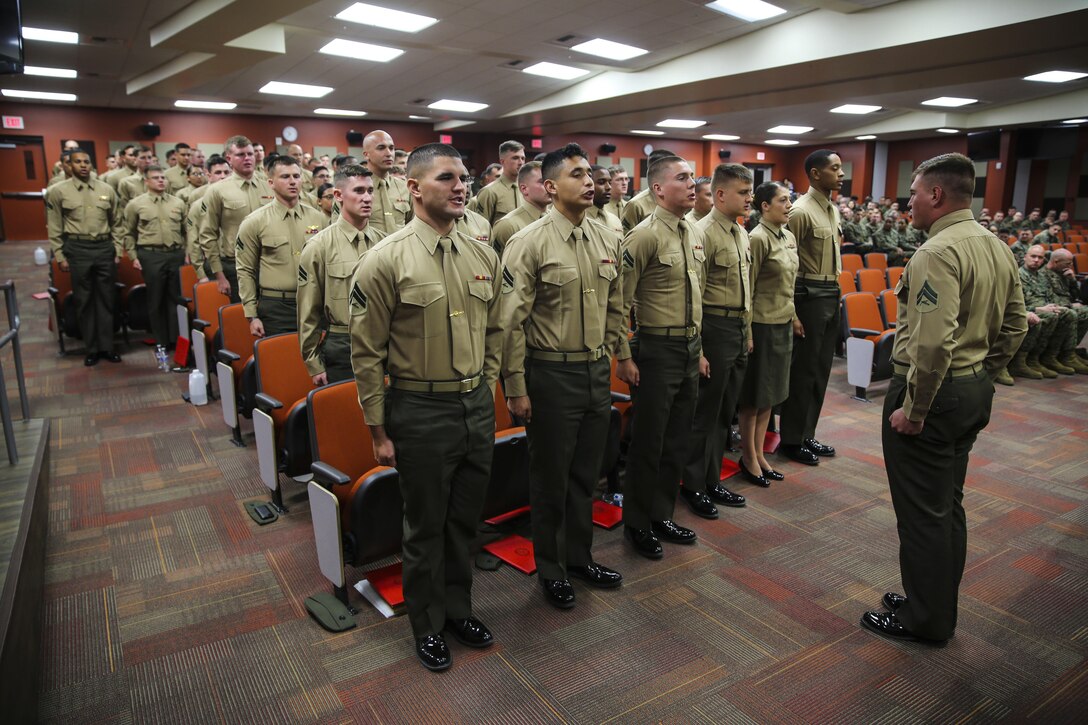 Marines with Marine Aircraft Group (MAG) 39 Corporals Course 341-16 recite the Noncommissioned Officer Creed during their graduation aboard Marine Corps Base Camp Pendleton, Calif., Jan. 27. Eighty-one Marines graduated the three-week long training course required for corporals to earn the next rank. (U.S. Marine Corps photo by Cpl. Alissa Schuning/Released)