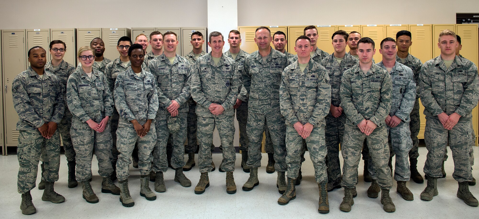 U.S. Air Force Col. Thomas Kunkel, 23d Wing commander, and Chief Master Sgt. David Kelch, 23d WG command chief, pose with members of the Moody Base Honor Guard, Jan. 28, 2016, at Moody Air Force Base, Ga. Guardsmen dedicate 4-6 months to provide military funeral honors and ceremonial support in over 50 counties in the South Georgia and North Florida area. (U.S. Air Force photo by Airman 1st Class Greg Nash/Released) 