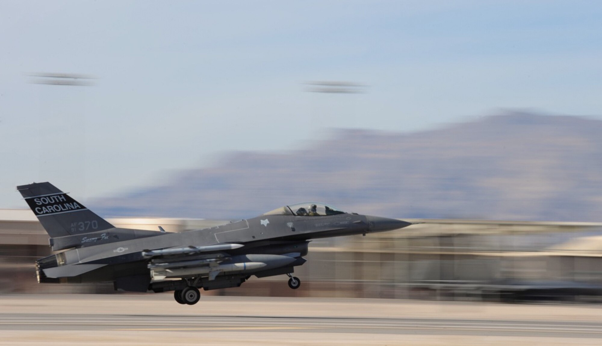 An F-16 Fighting Falcon assigned to the 157th Fighter Squadron at McEntire Joint National Guard Base, S.C., takes off from the flightine for a training sortie during Red Flag 16-1 at Nellis Air Force Base, Nev., Jan. 27, 2015. The squadron received its name from the South Carolina American Revolutionary War hero Francis Marion, who was nicknamed “The Swamp Fox.” (U.S. Air Force photo by Senior Airman Mikaley Kline)