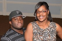 Staff Sgt. Eric Prince, 4th Component Maintenance Squadron aerospace propulsion journeyman, and Lowanda Ingram, , display their personality during a Fashion Club photo shoot, Jan. 26, 2016, at Seymour Johnson Air Force Base, North Carolina. The Fashion Club has 35 members who meet the first Sunday of every month. (U.S. Air Force photo/Airman 1st Class Ashley Williamson)