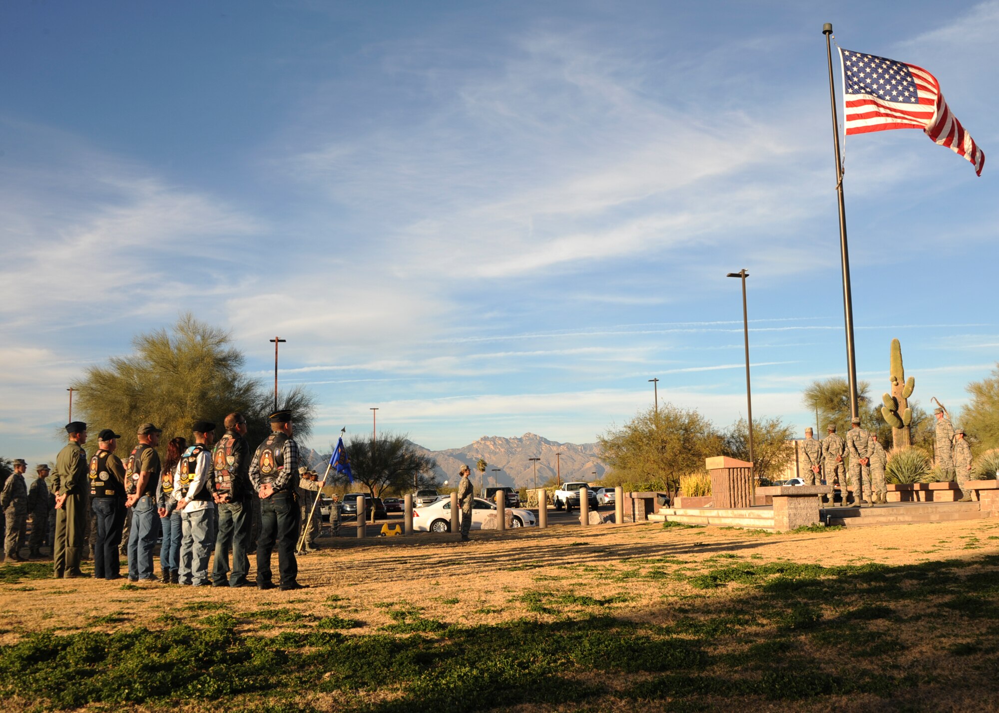 Veterans and U.S. Airmen prepare for a retreat ceremony at Davis-Monthan Air Force Base, Ariz., Jan. 28, 2016. The American flag flying outside the 355th Fighter Wing building was taken down ceremoniously and handed off to the McCulloch-Wagner American Legion Post109 to be retired. (U.S. Air Force photo by Airman Basic Nathan H. Barbour/Released)