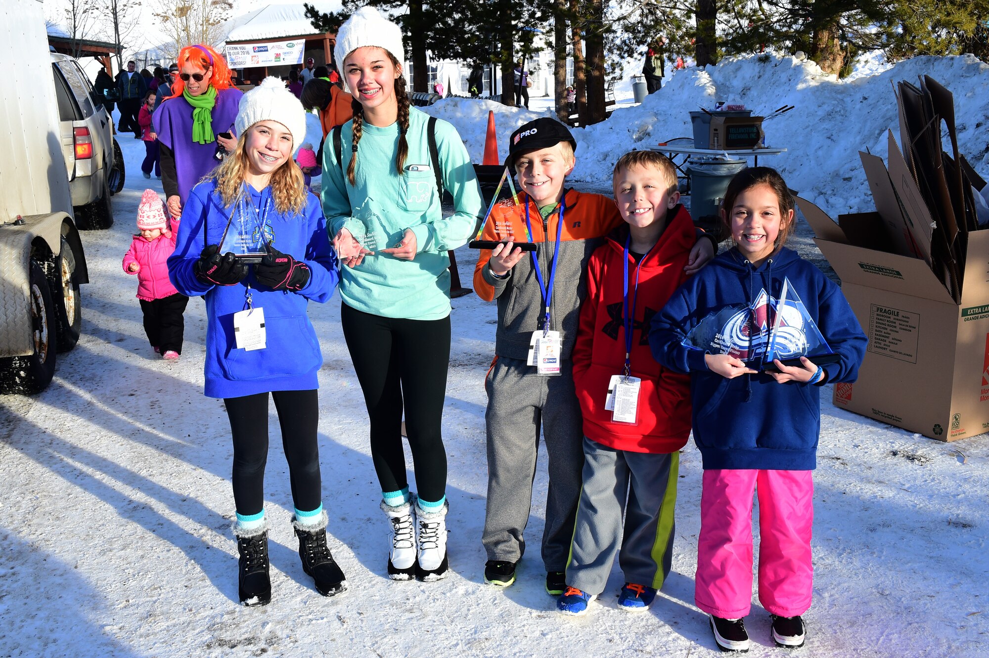 Winners of the Snofest cardboard derby pose with their trophies during Snofest Jan. 23, 2016, at Keystone Resort, Colo. Snofest is a military appreciation event at Keystone Resort for the Front Range Military Bases, that included a cardboard derby with nine categories including biggest crowd pleaser, fastest and most creative. (U.S. Air Force photo by Airman 1st Class Gabrielle Spradling/Released)