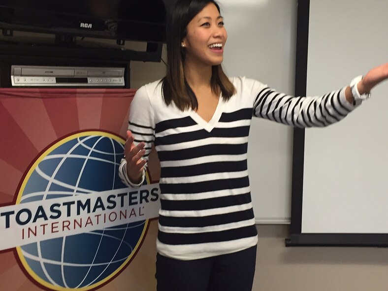 Sotheavy Jenkins, foreign military sales analyst for the Defense Security Cooperation Agency, practices making hand gestures to make her speeches more interesting during a meeting of the Wright Flyers Toastmasters Club at Wright-Patterson Air Force Base. (Skywrighter photos/Amy Rollins)