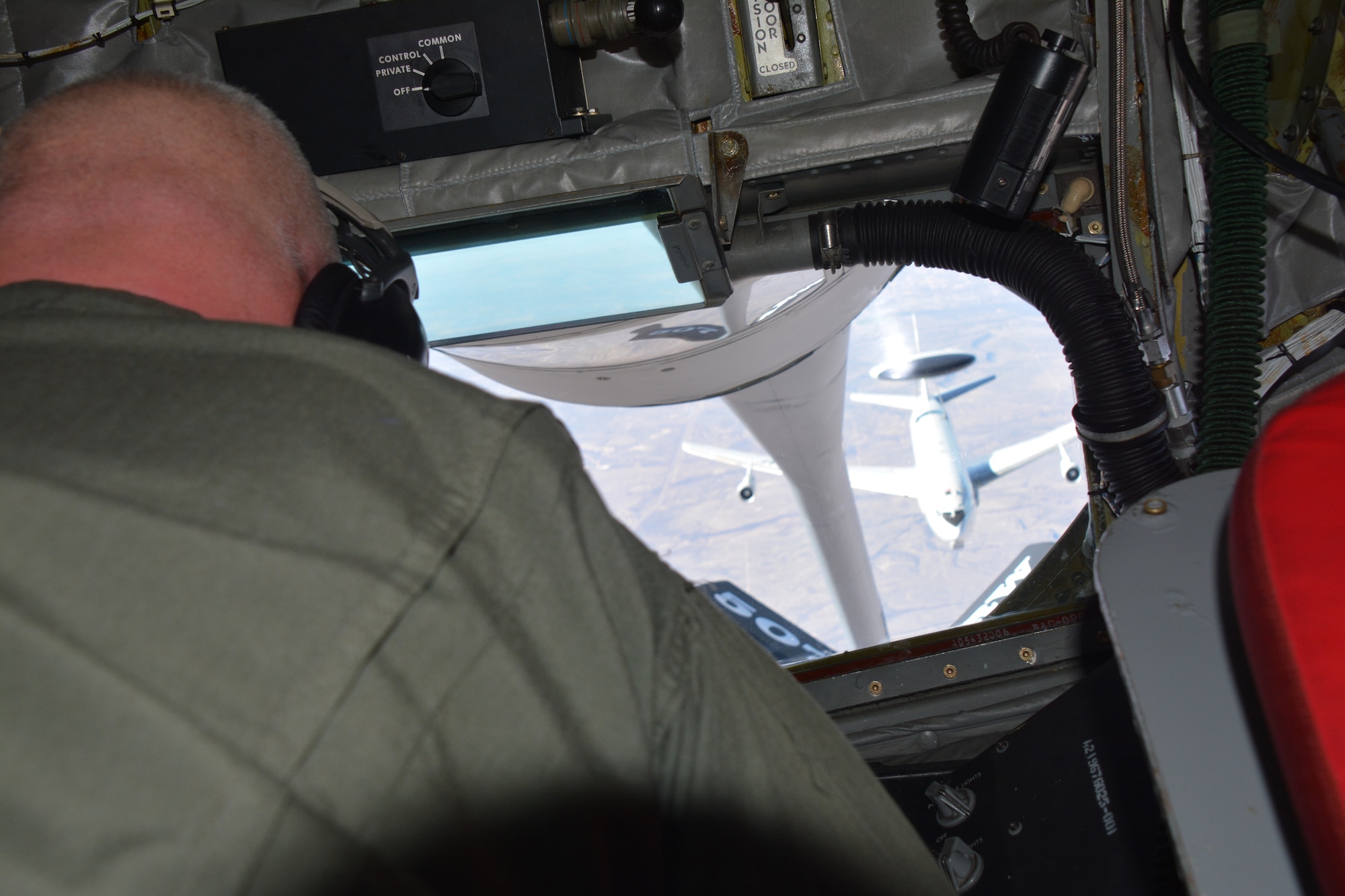 Master Sgt. Steven Stanton, a KC-135R in-flight refueling technician with the 465th Air Refueling Squadron at Tinker Air Force Base, Okla., operates the boom Jan. 19, 2016, during a aerial refueling of a E-3 Sentry over Texas.  Stanton and his crew fly and operate KC-135Rs out of the 507th Air Refueling Wing at Tinker Air Force Base, Okla. The 507th ARW is the largest Reserve flying unit in the state of Oklahoma. (U.S. Air Force/Maj. Jon Quinlan)
