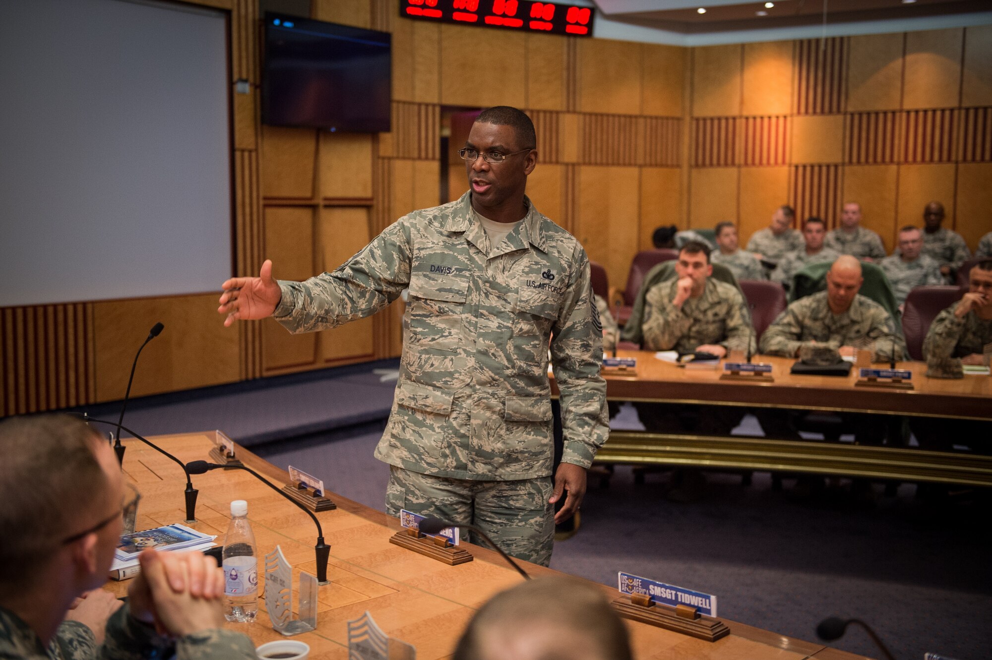 Chief master sergeant selects listen to Chief Master Sgt. James E. Davis, USAFE-AFAFRICA command chief, during a leadership course at Ramstein Air Base, Germany, Jan. 28, 2016. The Chiefs' Leadership Course offers senior level mentoring to the attending chief selects, gaining invaluable command specific perspectives, mission awareness and objectives. (U.S. Air Force photo/ Tech. Sgt. Ryan Crane)
