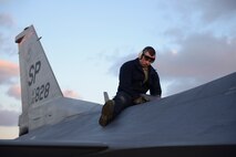 U.S. Air Force Staff Sgt. John King, a crew chief assigned to the 480th Expeditionary Fighter Squadron, inspects the aerial refuel receptacle on a 480th EFS F-16 Fighter Falcon fighter aircraft during a flying training deployment on the flightline at Souda Bay, Greece, Jan. 27, 2016. This FTD allows both U.S. Air Forces in Europe and the Hellenic air force to extend joint war-fighting capability through operational training. (U.S. Air Force photo by Staff Sgt. Christopher Ruano/Released)