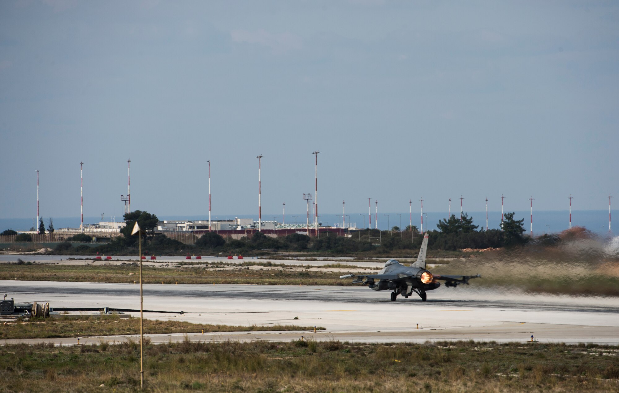 A U.S. Air Force F-16 Fighting Falcon fighter aircraft pilot assigned to the 480th Expeditionary Fighter Squadron, launches his jet during a flying training deployment on the runway at Souda Bay, Greece, Jan. 27, 2016.  The training included more than 15 aircraft launches a day as part of the training between the U.S. and Hellenic air forces. (U.S. Air Force photo by Staff Sgt. Christopher Ruano/Released)