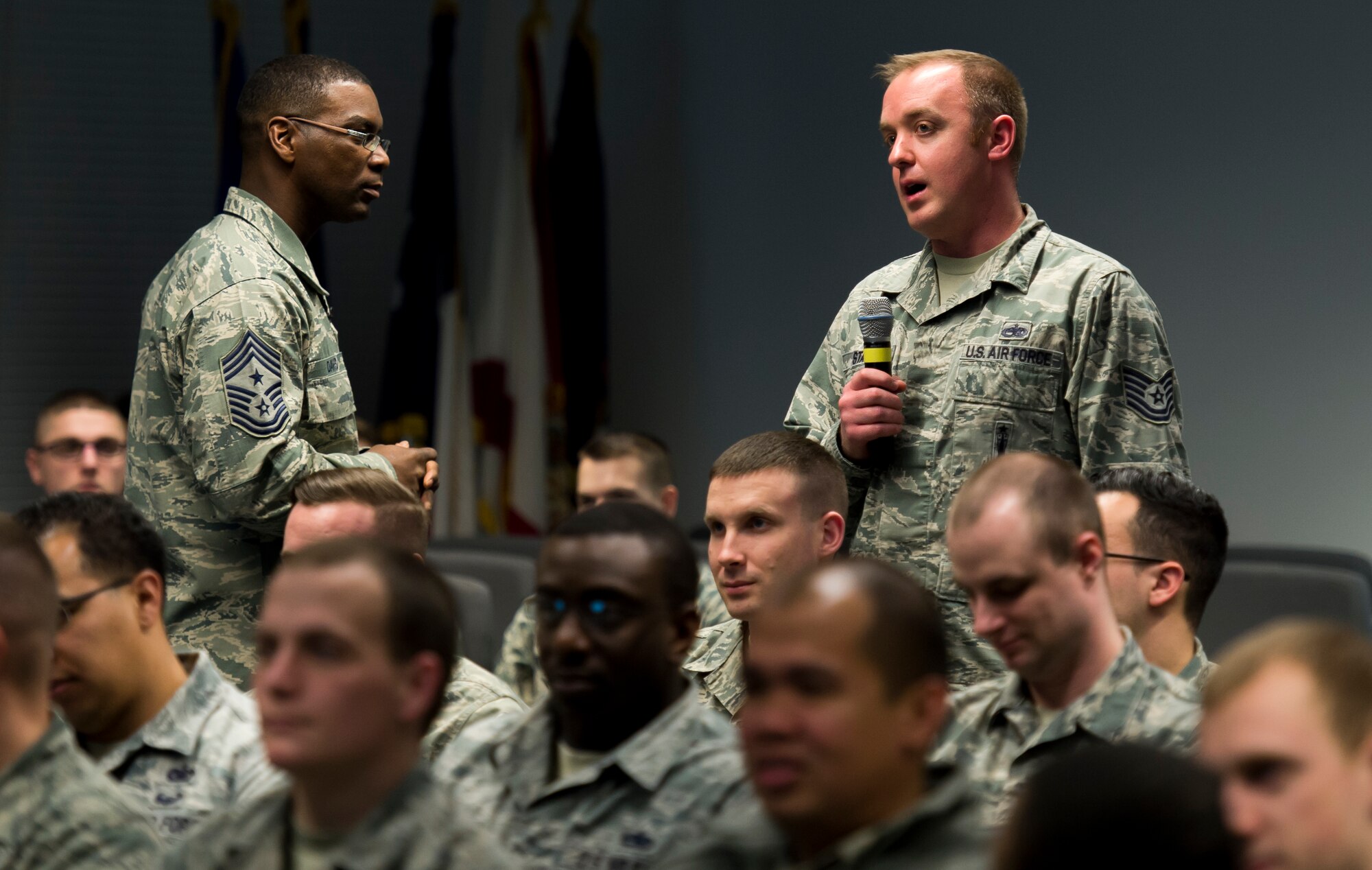 Chief Master Sgt. James E. Davis, U.S. Air Forces in Europe and Air Forces Africa command chief, talks about morality with Tech Sgt. Michael Staal, USAFE A5 NCO in charge of operational and adaptive plans, during a Kisling NCO Academy professional development course Jan. 22, 2015, on Kapaun Air Station, Germany. The PDC was the largest held with 135 attendees; lessons discussed ranged from knowing your role, professional military writing, stress management and much more. (U.S. Air Force photo/Senior Airman Jonathan Stefanko)