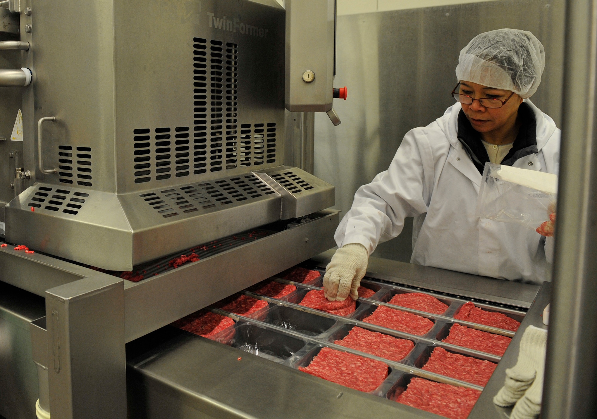 Teresa George, Defense Commissary Agency employee, quality controls ground beef at the Ramstein Central Meat Processing Plant Jan. 25, 2016, at Ramstein Air Base, Germany. The Ramstein CMPP consolidated with the plants in Rhein-Main and Lakenheath on March 16, 1998 and is the only meat processing plant in the Department of Defense. (U.S. Air Force photo/Airman 1st Class Larissa Greatwood)