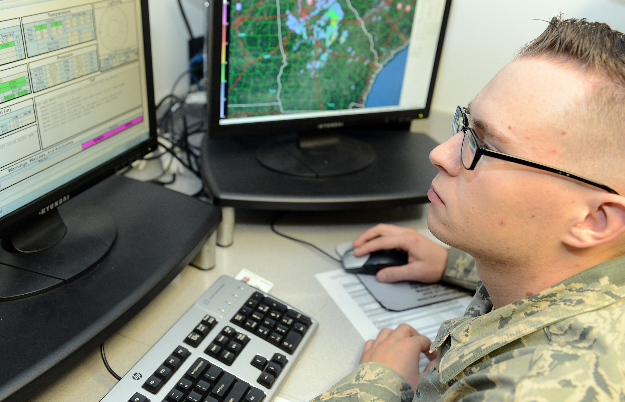 Airman 1st Class Johnathon Harry, 78th Air Base Wing weather forecaster, monitors weather activity at Robins Air Force Base. (U.S. Air Force photo by Tommie Horton)