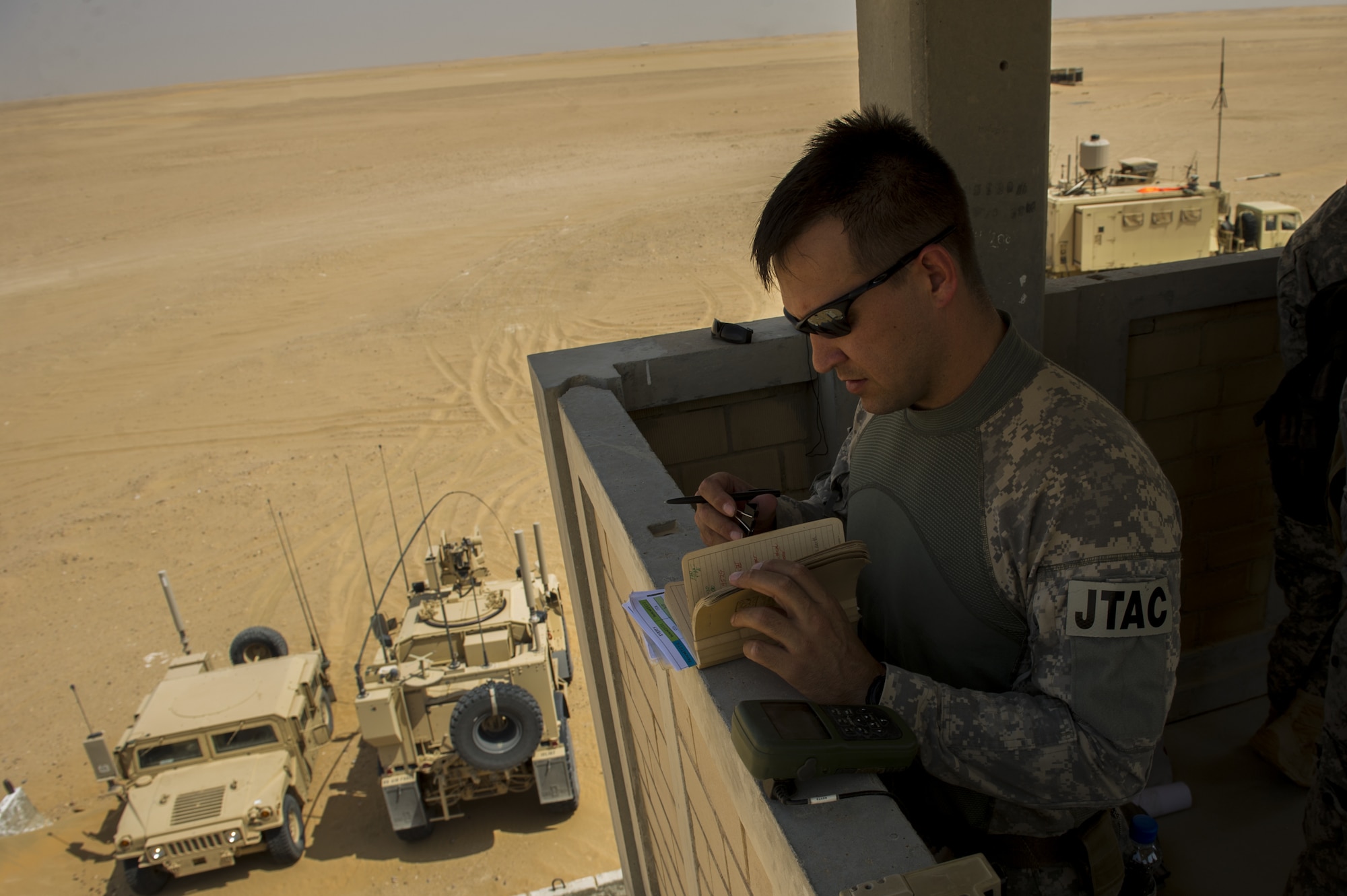 U.S. Air Force Staff Sgt. Jedidiah Pearson, 82nd Expeditionary Air Support Operations Squadron joint terminal attack controller, prepares for a Joint Air Attack Team live-fire exercise at an undisclosed location in Southwest Asia, Sept. 18, 2013. The Hanscom AFB-based program office responsible for equipping JTAC vehicles with communication tools needed to call in close-air support issued a delivery order for a new Mobile Communication System to be placed on M1145 Humvees, Jan. 29, 2016. The order is leveraging a new PEITSS contract vehicle for expedited delivery of the system. (U.S. Air Force photo by Staff Sgt. Stephany Richards)  