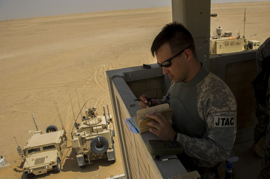U.S. Air Force Staff Sgt. Jedidiah Pearson, 82nd Expeditionary Air Support Operations Squadron joint terminal attack controller, prepares for a Joint Air Attack Team live-fire exercise at an undisclosed location in Southwest Asia, Sept. 18, 2013. The Hanscom AFB-based program office responsible for equipping JTAC vehicles with communication tools needed to call in close-air support issued a delivery order for a new Mobile Communication System to be placed on M1145 Humvees, Jan. 29, 2016. The order is leveraging a new PEITSS contract vehicle for expedited delivery of the system. (File photo) 
