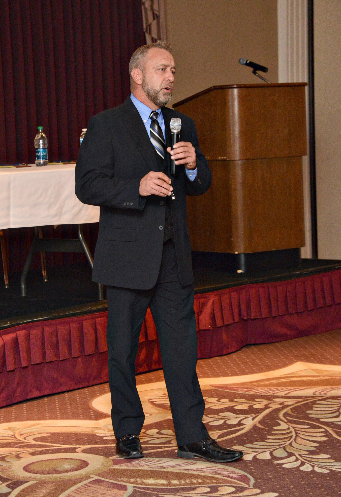 Robert Whittington, community manager for Balfour Beatty Communities, gives updates to attendees at the Jan. 21 Town Hall Meeting about base housing, including a self-help program that all housing residents can participate in to help beautify the base and their neighborhoods.  (Air Force photo by Kelly White/Released)