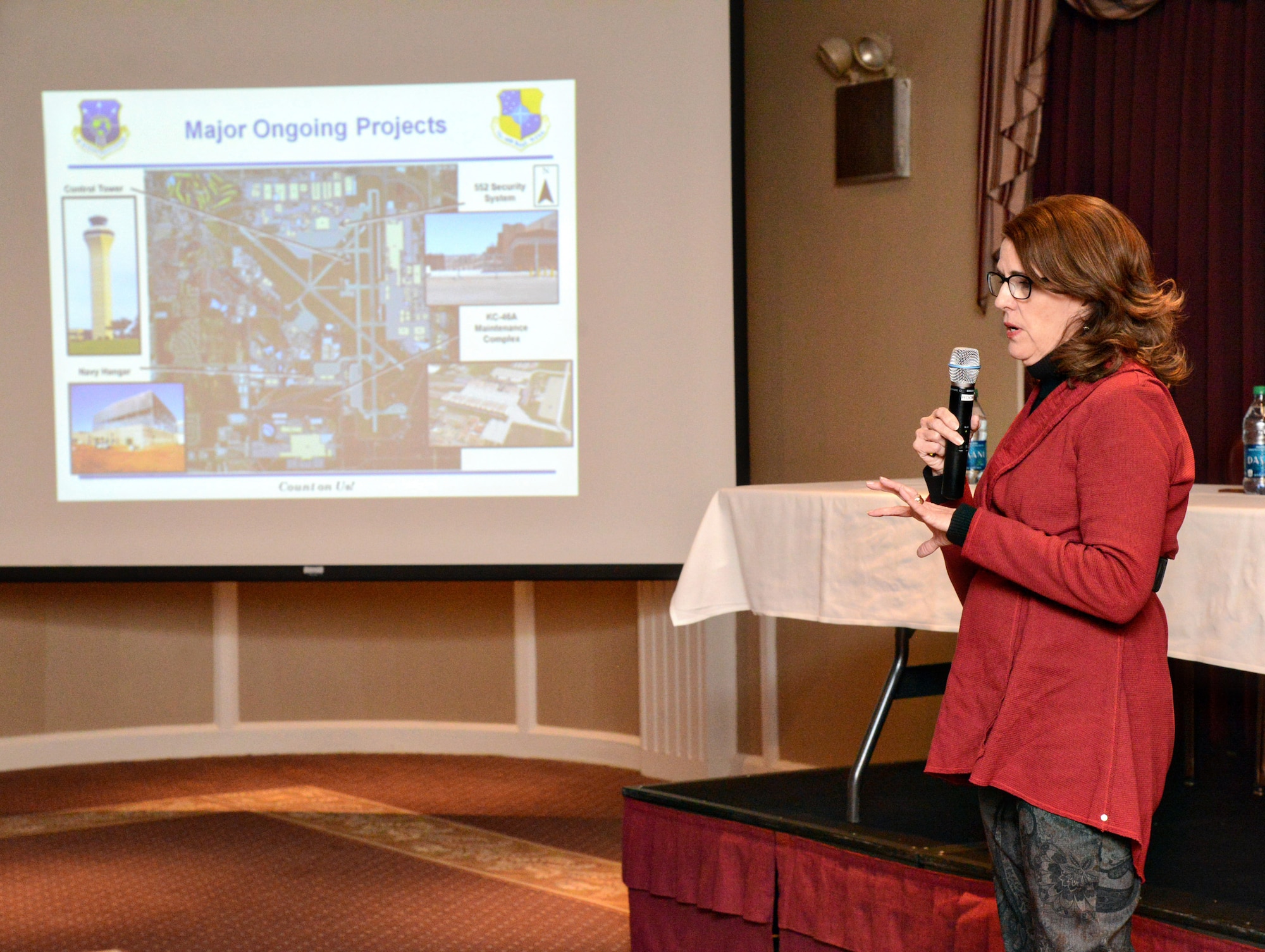 Cathy Scheirman, 72nd Air Base Wing Civil Engineer Directorate chief and base civil engineer, talks about current major ongoing projects on base, including storm shelter installations, new hangars, the new 552nd Air Control Wing security system ramp and entry control point, as well as discussing upcoming plans for construction around the installation during the Jan. 21 Town Hall Meeting at the Tinker Club. (Air Force photo by Kelly White/Released)