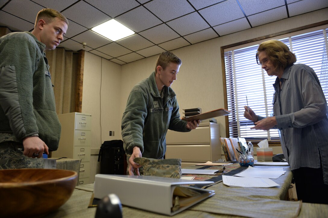 Airman 1st Class Justin McGovern receives paperwork from tax center volunteer Clare Robinson Jan. 25 at Hill Air Force Base, Utah. The base tax center is located in the Poe Conference Center, building 1295. (U.S. Air Force photo by R. Nial Bradshaw)
