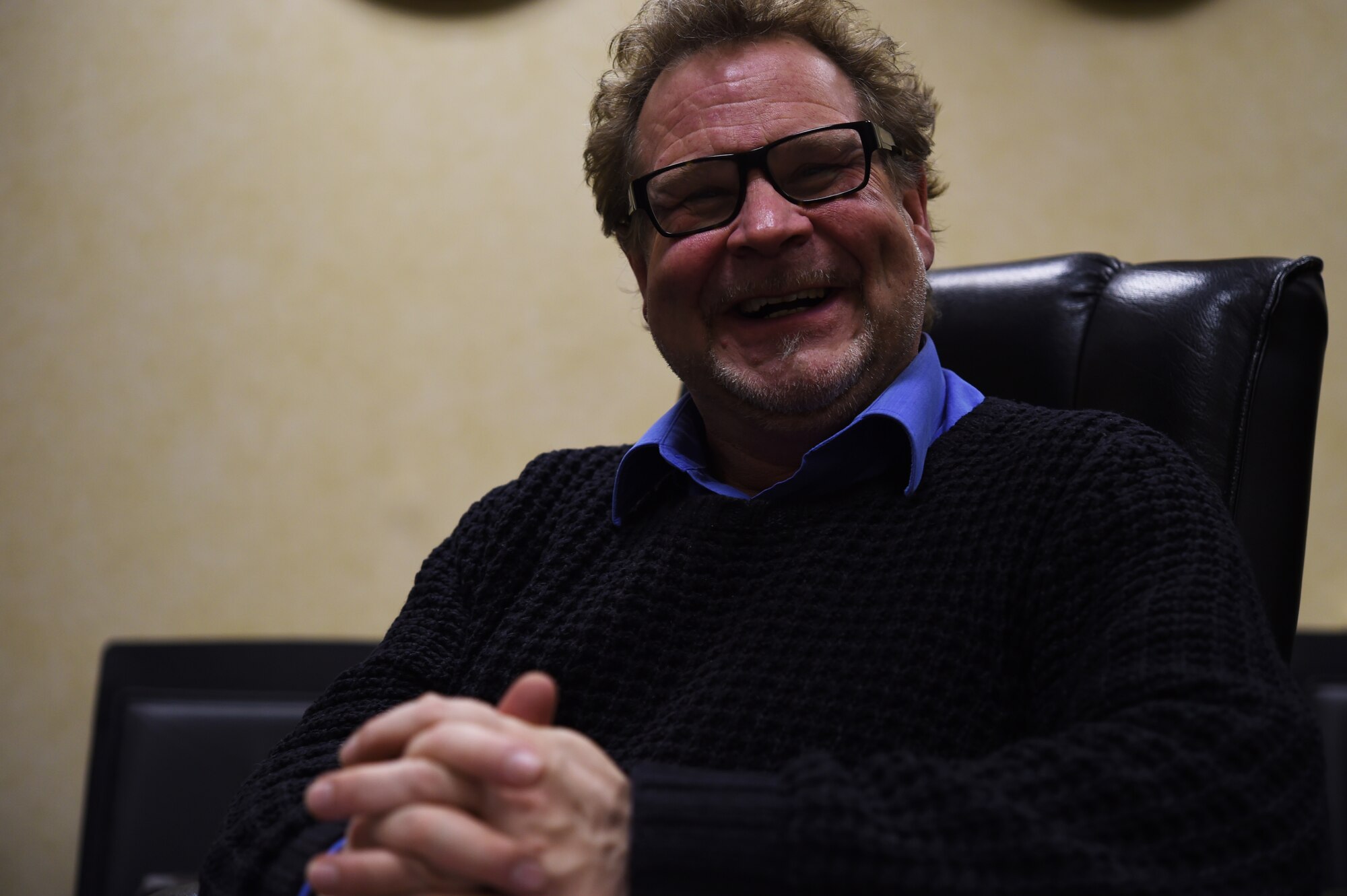 Cymon Snow, 422nd Air Base Group British American Committee Chairman, laughs as he likens the relationship between the United States and United Kingdom to a familial one, during a conversation at RAF Croughton, United Kingdom, Jan. 21, 2016. As the newly-appointed BAC Chairman, Snow said he is committed to enhancing the already strong relationship between U.S. Service members and the local community. (U.S. Air Force photo by Tech. Sgt. Jarad A. Denton/Released)  