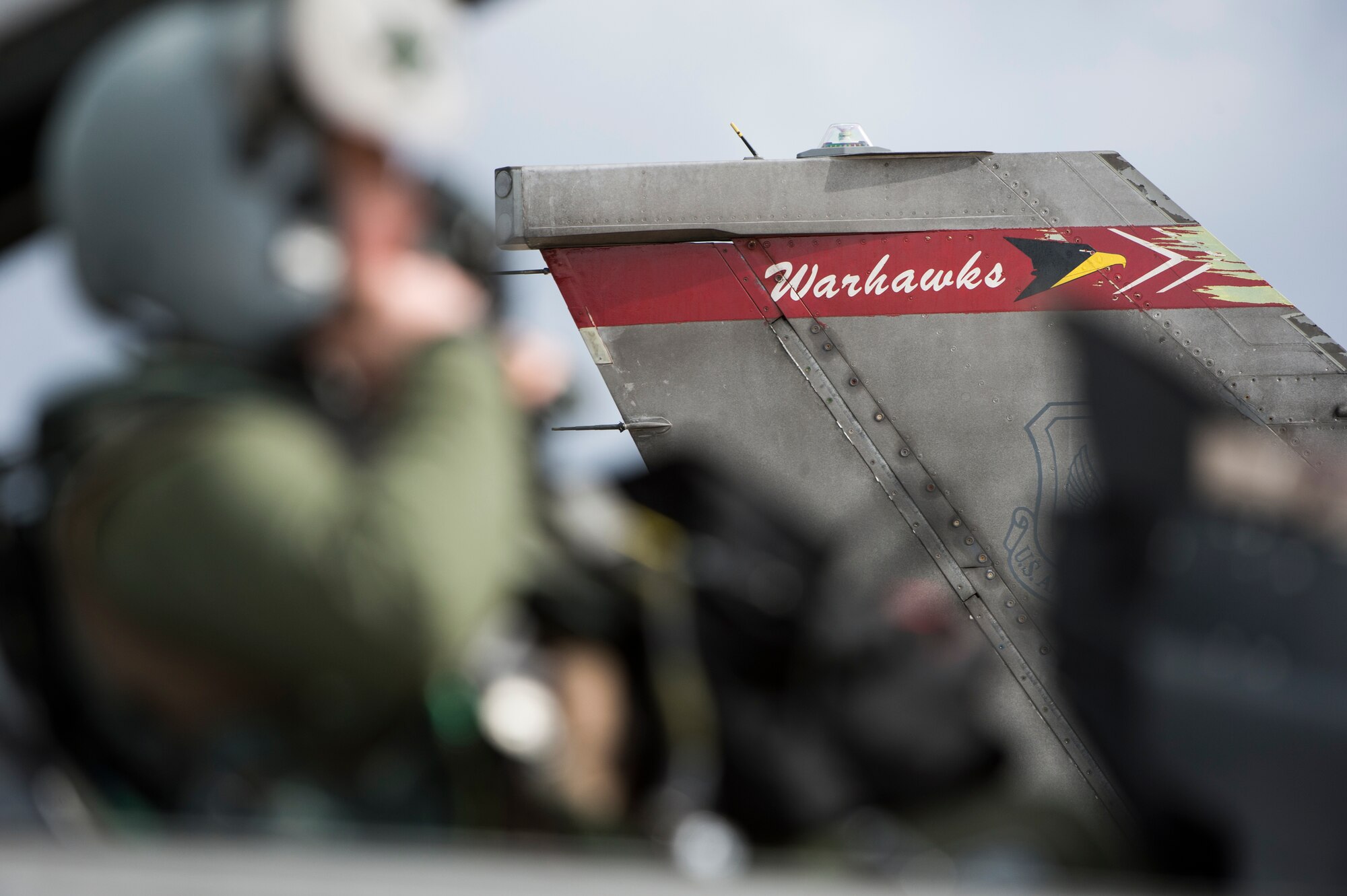 A U.S. Air Force F-16 Fighting Falcon fighter aircraft pilot assigned to the 480th Expeditionary Fighter Squadron fastens his helmet while in the aircraft's cockpit on the flightline during a flying training deployment at Souda Bay, Greece, Jan. 27, 2016. Eighteen F-16s from the 52nd Fighter Wing at Spangdahlem Air Base, Germany, participated in the deployment, which marked the fourth of its kind on the island since 2014. (U.S. Air Force photo by Staff Sgt. Christopher Ruano/Released)
