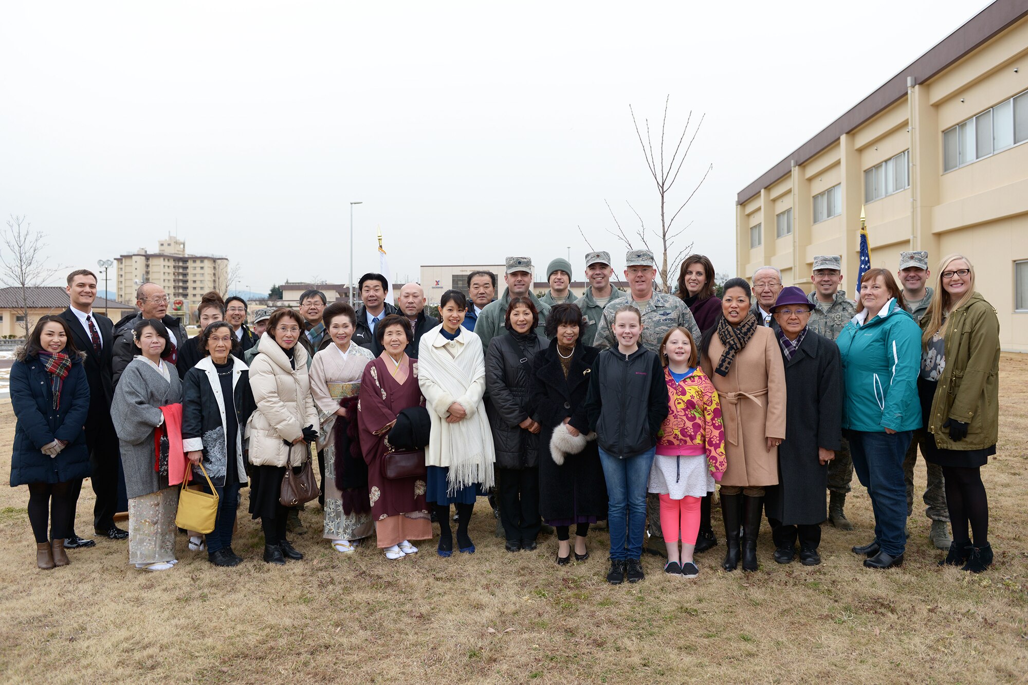 Members of the Hamura-Yokota Friendship Club gather before a tree planting ceremony at Yokota Air Base, Japan, Jan. 23, 2016. The tree planting ceremony represented the friendship between the 730th Air Mobility Squadron and 515th Air Mobility Operations Group and the city of Hamura; it also recognized the 10-year anniversary of the friendship club. (U.S. Air Force photo by Staff Sgt. Cody H. Ramirez/Released)