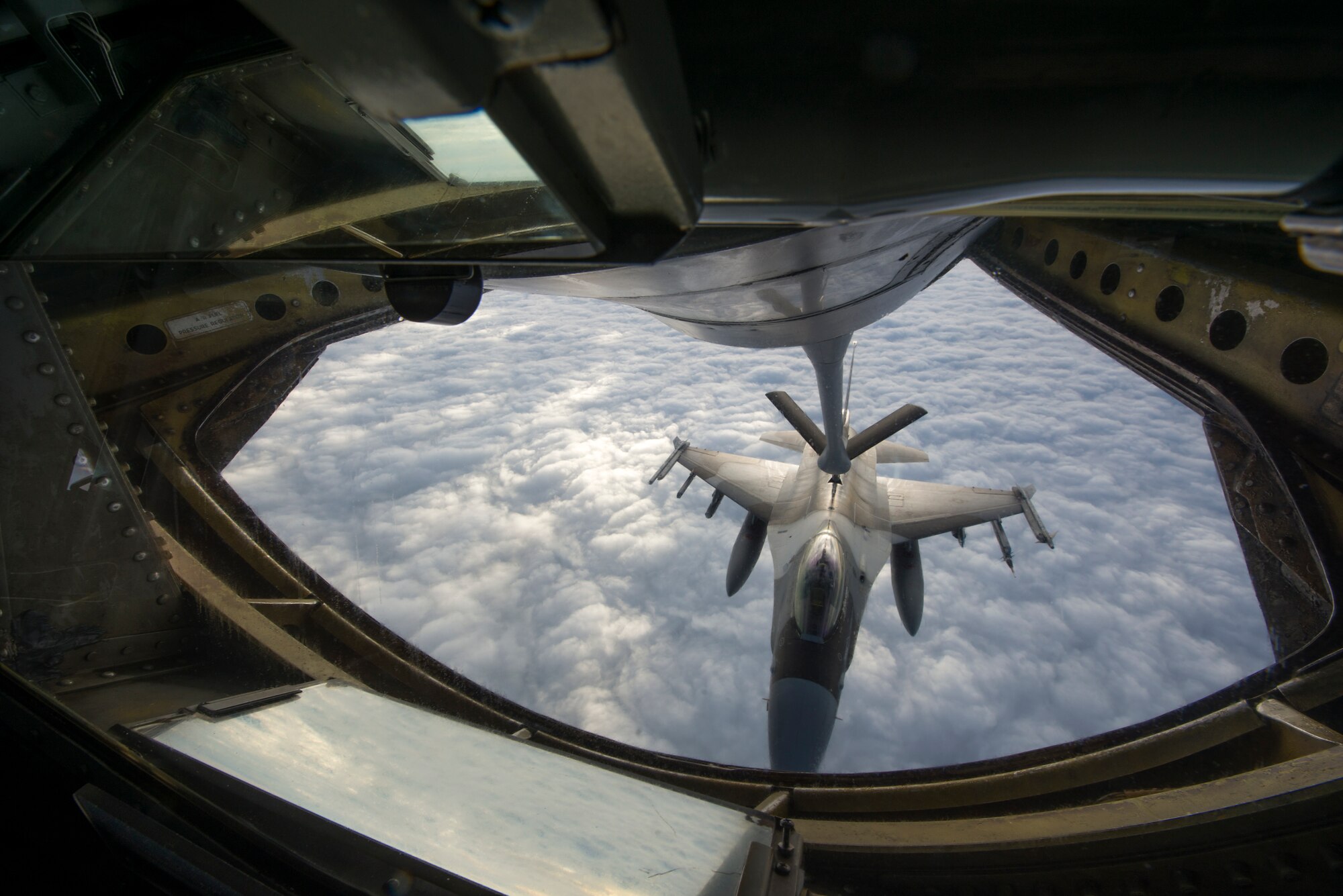 A U.S. Air Force F-16 Fighting Falcon from the 18th Aggressor Squadron at Eielson Air Force Base, Alaska, links up with a 909th Air Refueling Squadron KC-135 Stratotanker for refueling Jan. 28, 2016, near Okinawa, Japan. During the large force exercise, the 909th ARS refueled a total of 132 aircraft to include 65 F-15 Eagles, 14 F-16 Fighting Falcons, 32 F-22 Raptors and one E-3 Sentry, as well as 20 U.S. Marine Corps F/A-18 Hornets. (U.S. Air Force photo by Staff Sgt. Maeson L. Elleman)