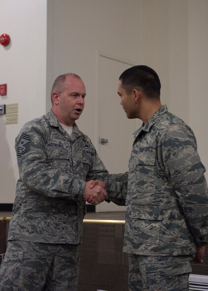 Command Chief Master Sergeant of the Air National Guard James W. Hotaling identified the newest member, Airman Basic Joshua Cox assigned to the 124th Aircraft Maintenance Squadron, and called him to the stage at an enlisted all during his visited the 124th Fighter Wing at Gowen Field, Boise, Idaho, Jan. 9, 2016. (U.S. Air National Guard Photos by Tech. Sgt. Sarah Pokorney)