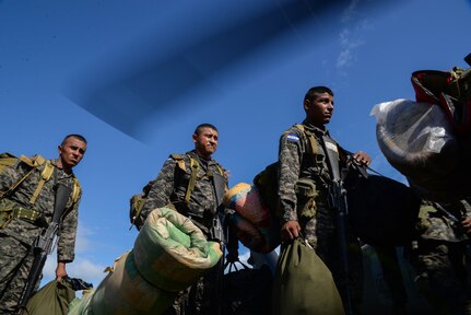 Honduran troops load on to a U.S. Army UH-60 Blackhawk helicopter during a troop rotation, in the Gracias a Dios Department (state), Honduras, Jan. 14, 2016. The rotation is part of Operation CARAVANA, in which the U.S. supports Honduras in countering the trafficking of illicit materials in the region by transporting troops via helicopter to hard to reach locations in eastern areas of the country. (U.S. Air Force photo by Senior Airman Westin Warburton/Released)