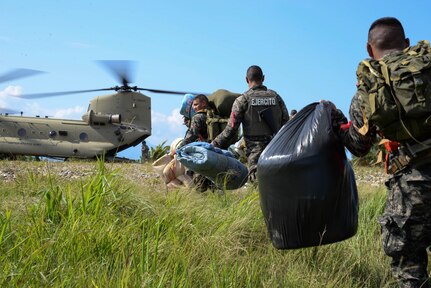 Honduran troops load onto a U.S. Army CH-47 Chinook helicopter in the Gracias a Dios Department (state), Honduras, Jan. 13, 2016. The troops are part of over 5,000 Honduran soldiers the U.S. has helped transport since October 2014, to help disrupt drug trafficking in Honduras, which has been the focus of the Honduran government. (U.S. Air Force photo by Senior Airman Westin Warburton/Released)
