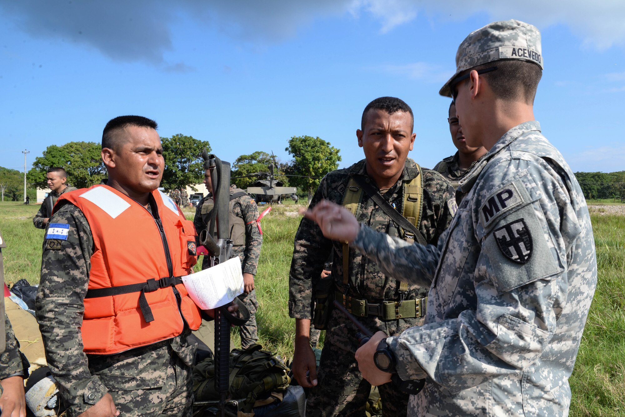 U.S. Army Sgt. Saul Acevedo, Joint Task Force-Bravo Joint Security Forces, discusses boarding procedures with Honduran soldiers, in the Gracias a Dios Department (state), Honduras, Jan. 13, 2016. Acevedo acted as Spanish-speaking a liaison between the U.S. Service members and Honduran troops during the U.S. support to Operation CARAVANA, a Honduran effort to disrupt drug trafficking in hard to reach locations in eastern Honduras. (U.S. Air Force photo by Senior Airman Westin Warburton/Released)
