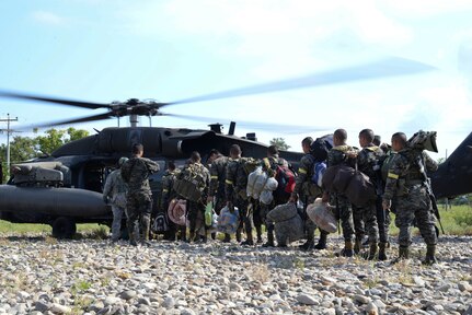 Honduran troops board a U.S. Army UH-60 Blackhawk helicopter in Gracias a Dios Department (state), Honduras, Jan. 13, 2016. The Honduran Army conducts troops in the area to disrupt drug trafficking throughout Honduras and ultimately the greater drug trafficking network in Central America. (U.S. Air Force photo by Senior Airman Westin Warburton/Released)