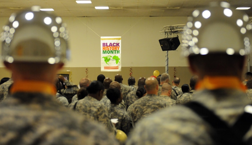 Service members join together to celebrate Black History Month at the East Morale, Welfare and Recreation Center Joint Base Balad, Iraq Feb., 26.
