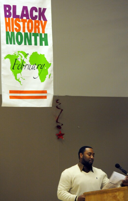 Robert Romeo Betts, a civilian material control manager and force protection transportation site manager from Fort Bragg, N.C., recites a self-written poem for Black History Month at the East Morale, Welfare and Recreation facility Feb. 26 at Joint Base Balad, Iraq.