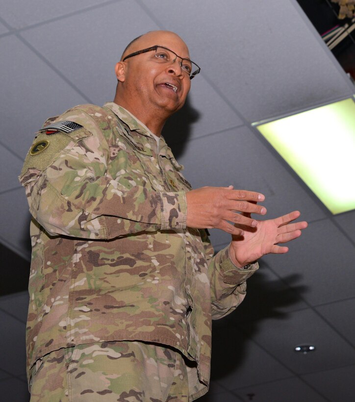 Army Maj. Henry McCaskill, Jr., the operations chaplain (forward) for the 1st Theater Sustainment Command, speaks to hundreds of service members, contractors and Department of Defense civilians about his experiences growing up in Alabama during the 1960s. McCaskill's father, Henry McCaskill, Sr., helped organize many of the rallies, marches and meetings associated with King's civil rights movement while dealing with threats to burn his home and harm his family. During his presentation held Jan. 20 at Camp Arifjan, Kuwait, the chaplain also expressed his respect for King as a proponent for love, equality and non-violence, and he urged his audience to mimic those qualities in their lives.
