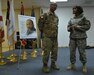 Army Maj. Henry McCaskill, Jr. (left), the operations chaplain (forward) for the 1st Theater Sustainment Command, speaks with Army Lt. Col. Ashawn D. Campbell (right), the equal opportunity program manager for the Army Central, at the conclusion of a Dr. Martin Luther King Jr. celebration held Jan. 20 in Camp Arifjan, Kuwait. McCaskill, currently deployed to Afghanistan, spoke to hundreds of service members, contractors and Department of Defense civilians about his experiences growing up in Alabama at a time when his father, Henry McCaskill, Sr., was organizing rallies, marches and meetings in support of King’s civil rights movement.