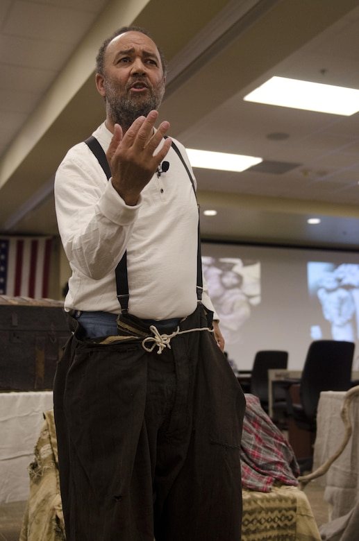 North Carolina professional storyteller, Mitchell G. Capel presents works by Paul L. Dunbar, a Civil War era poet and former slave, to the U.S. Army Reserve audience, Feb. 5, 2014, at Fort Bragg, N.C. The "brown bag" presentation was a part of the command's Black History Month celebration.