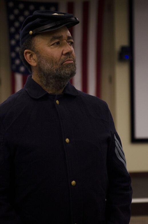 North Carolina professional storyteller, Mitchell G. Capel presents works by Paul L. Dunbar, a Civil War era poet and former slave, to the U.S. Army Reserve audience, Feb. 5, 2014, at Fort Bragg, N.C. The "brown bag" presentation was a part of the command's Black History Month celebration.