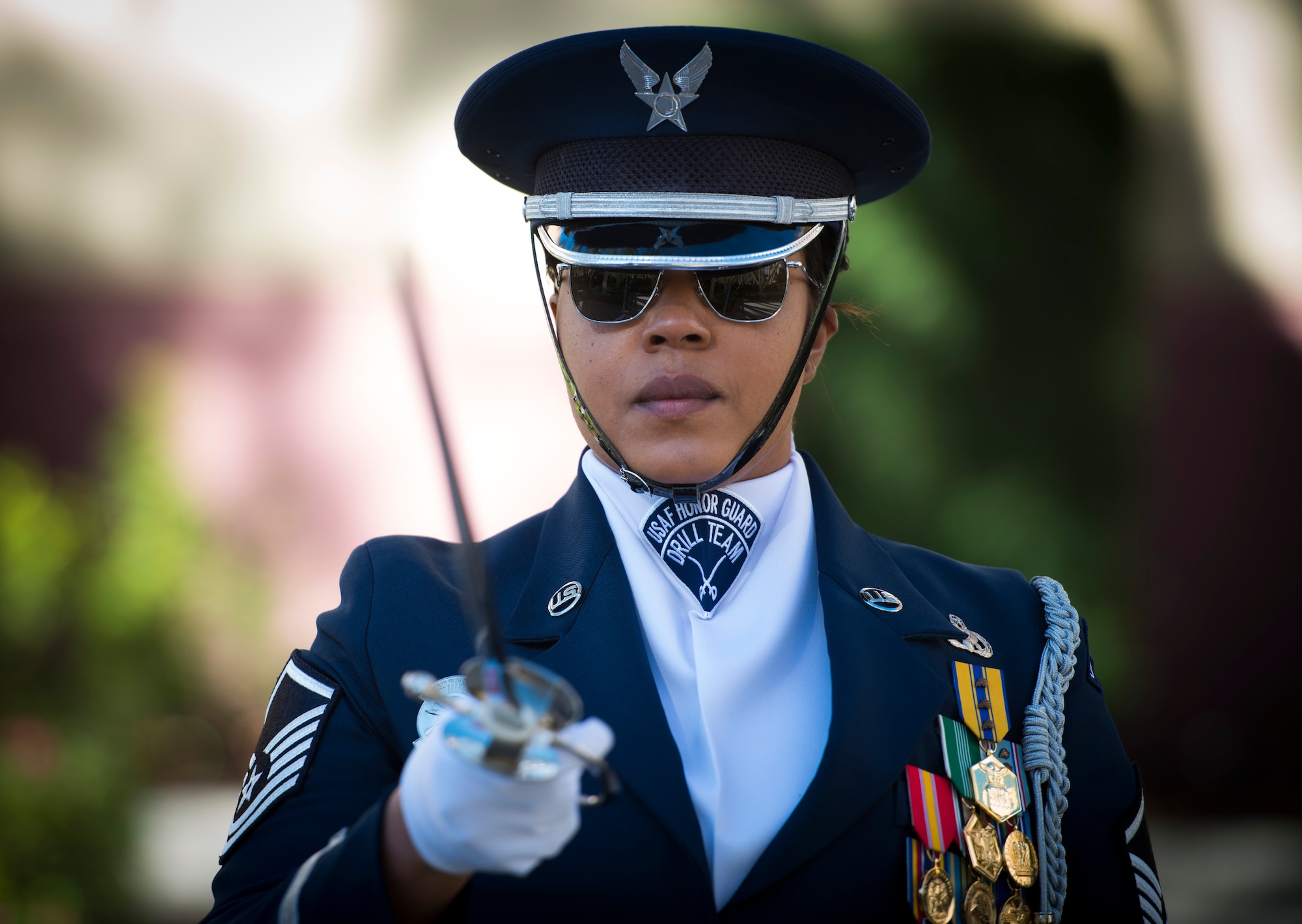 Master Sgt. Tameka Woods, United States Air Force Honor Guard drill team superintendent, salutes with her saber during a drill rehearsal prior to performing at Universal Studios in Orlando, Fla. Jan. 20, 2016. In addition to performing at Universal Studios, the Honor Guard also stopped at Disney World and held a performance for base leadership at Patrick Air Force Base. (U.S. Air Force photo by Staff Sgt. Chad C. Strohmeyer/Released)