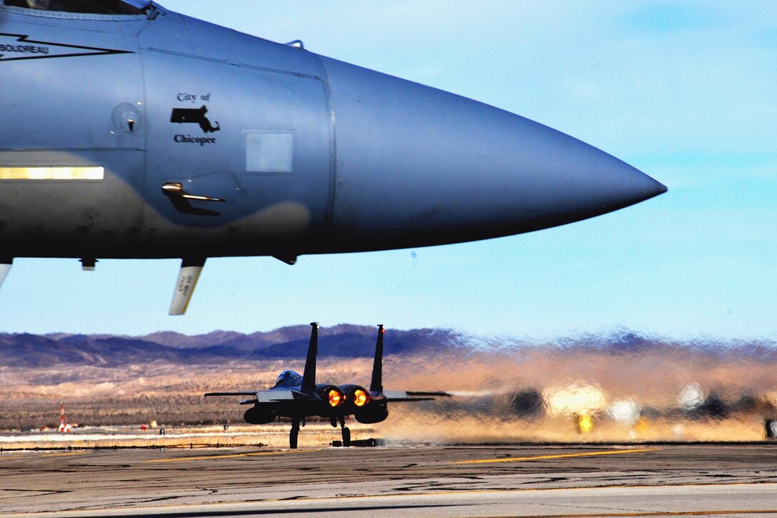 An F-15 Eagle takes flight during Exercise Red Flag 16-1 on Nellis Air Force Base, Nev., Jan. 25, 2016. The aircraft is assigned to the Massachusetts National Guard's 104th Fighter Wing. The large-scale exercise prepares troops for deployment. Air National Guard photo by Senior Airman Loni Kingston