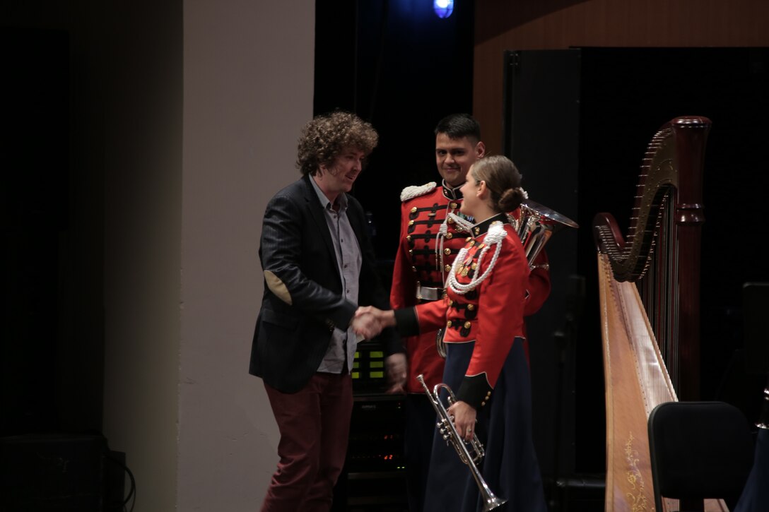 On Sunday, Jan. 31, 2016 Assistant Director 1st Lt. Ryan J. Nowlin led the Marine Band in a program titled "Childhood Dreams" at the Rachel M. Schlesinger Concert Hall at Northern Virginia Community College in Alexandria. Tom Davoren, the composer of the selection "Ascension," was on hand to enjoy the standing ovation his music elicited from the audience. (U.S. Marine Corps photo by Master Sgt. Kristin duBois/released)