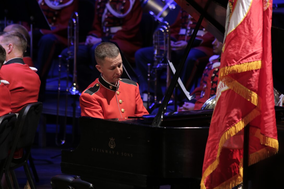 On Sunday, Jan. 31, 2016 Assistant Director 1st Lt. Ryan J. Nowlin led the Marine Band in a program titled "Childhood Dreams" at the Rachel M. Schlesinger Concert Hall at Northern Virginia Community College in Alexandria. Tom Davoren, the composer of the selection "Ascension," was on hand to enjoy the standing ovation his music elicited from the audience. (U.S. Marine Corps photo by Master Sgt. Kristin duBois/released)