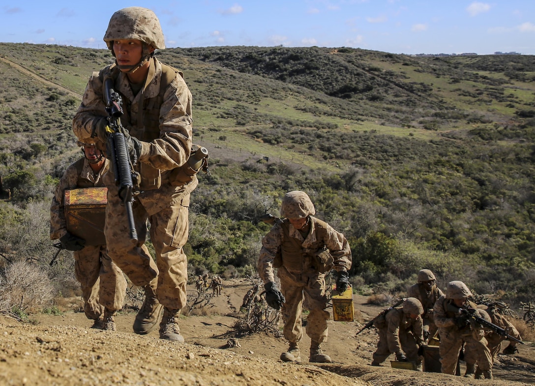 Private First Class Jonghyun Lee, Fox Company, 2nd Recruit Training Battalion, lead his squad up a hill with ammunition cans to resupply their fighting positions during the Basilone’s Challenge Crucible event at Marine Corps Base Camp Pendleton, Calif., Jan. 20, 2016. Recruits are expected to run up and down the hill multiple times to create fatigue and imitate combat. Annually, more than 17,000 males recruited from the Western Recruiting Region are trained at MCRD San Diego. Fox Company is scheduled to graduate Jan. 29.

